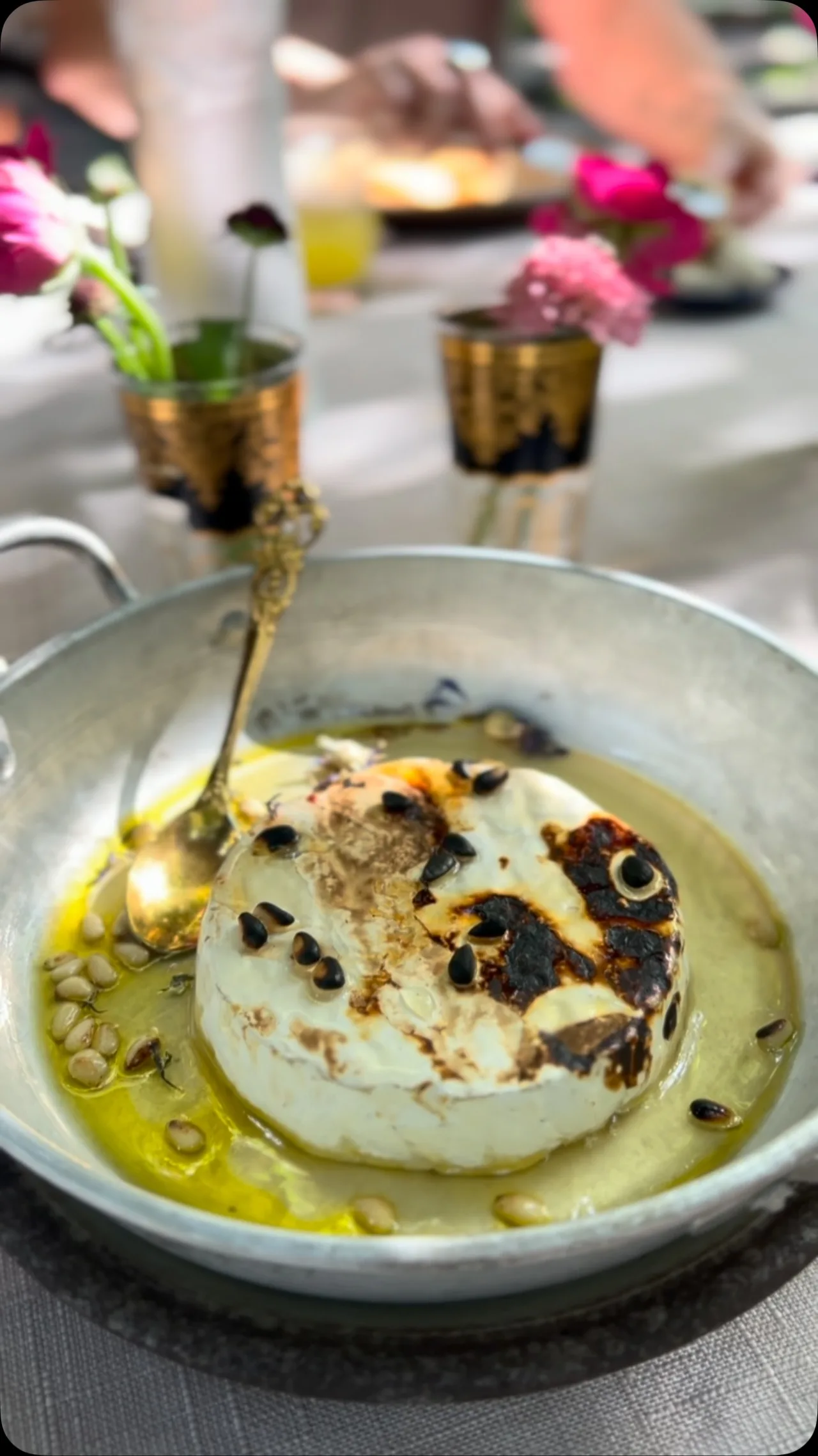 Goat camembert with olive oil, thyme, pine nuts and honey